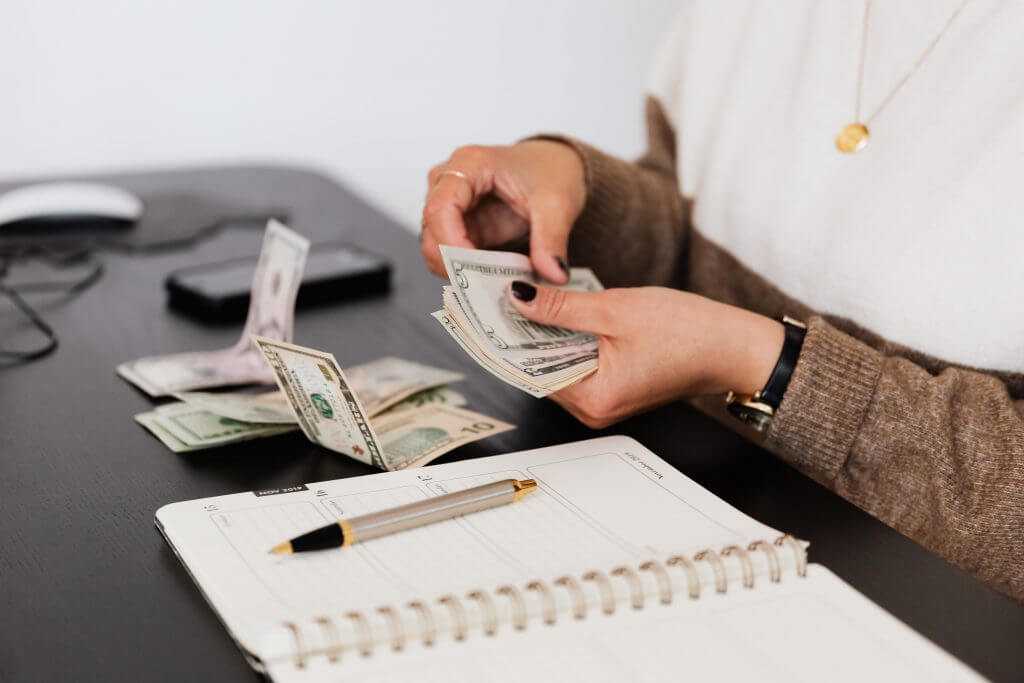 person counting bills