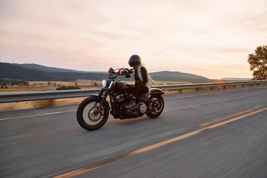 person riding motorcycle at sunset