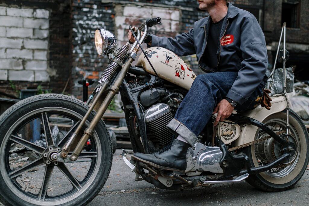 man sitting on motorcycle